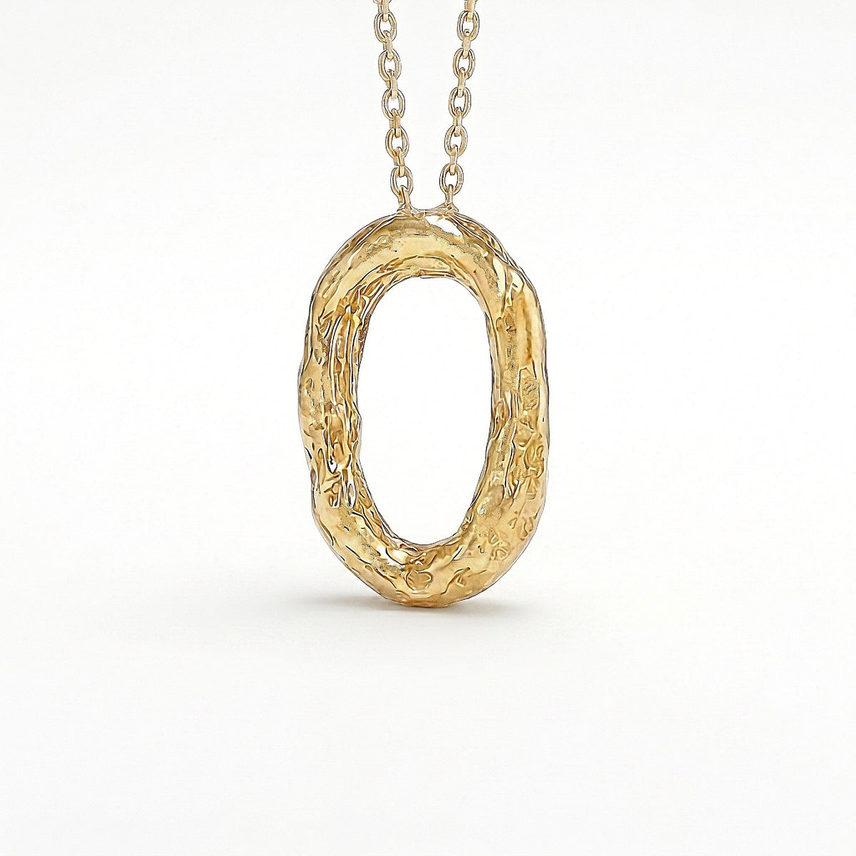 Colgante Órbita ovalado en oro vermeil con textura martillada