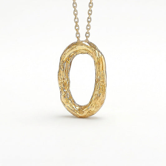 Colgante Órbita ovalado en oro vermeil con textura martillada