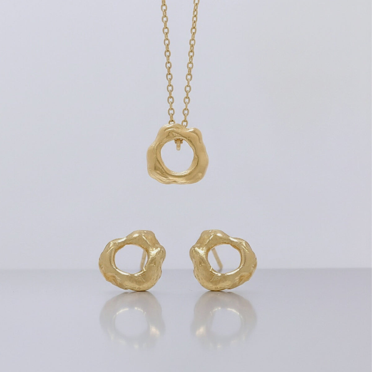 Colgante y pendientes Agujero Negro en oro vermeil